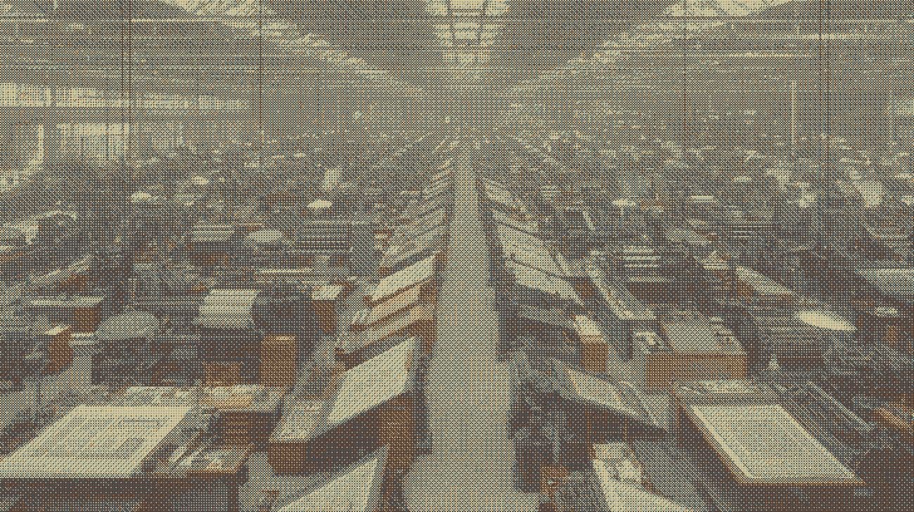Rows of identical drafting stations running the length of a hall, as a dithered print.